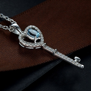 key pendant with gemstone