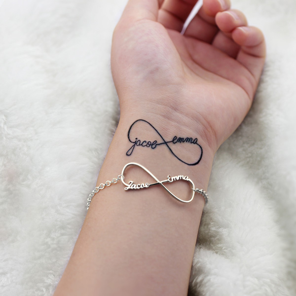 Little wrist tattoo of a infinity symbol with an anchor